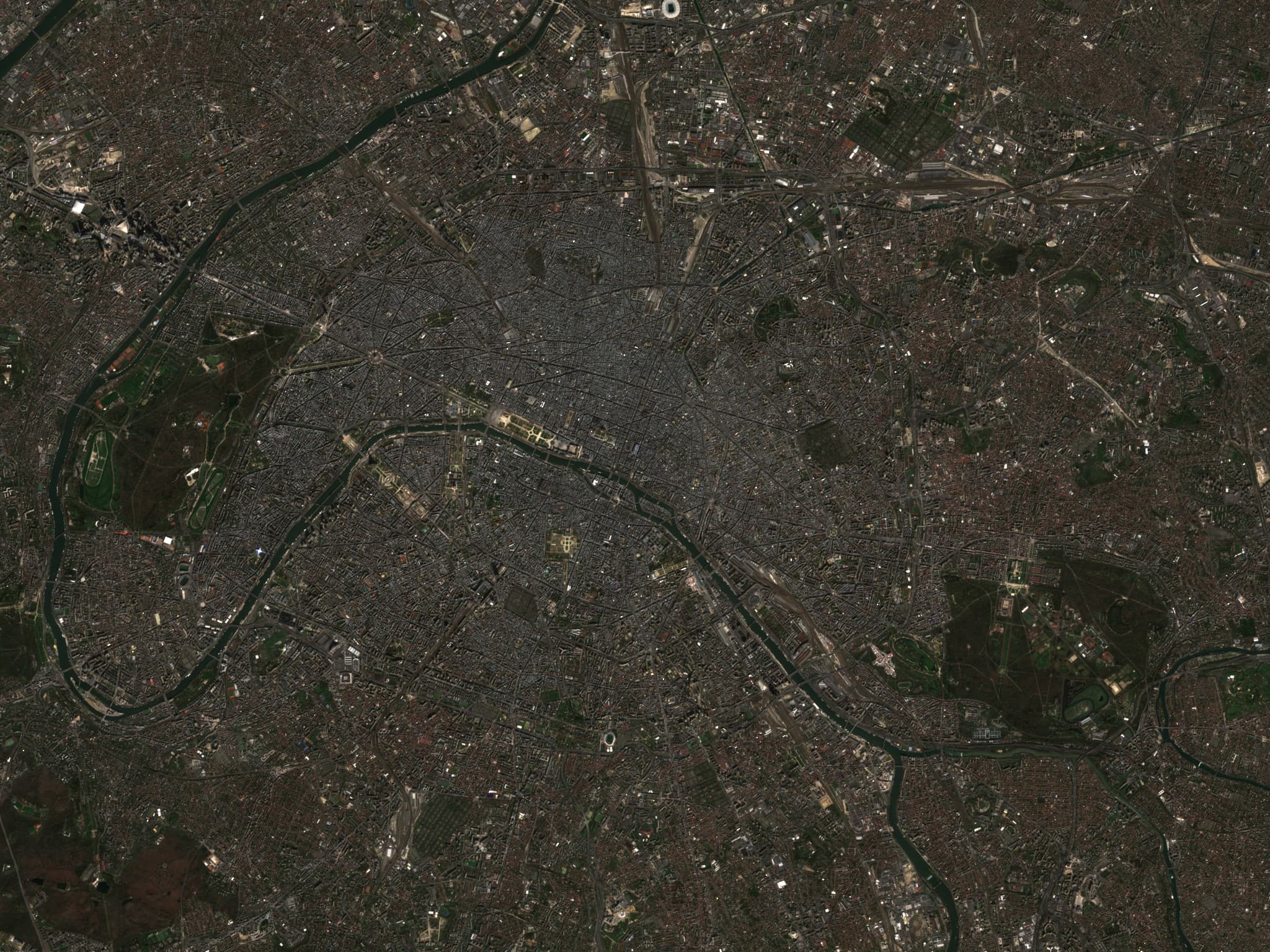 Satellite view of a dense capital city and river network